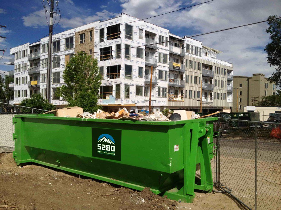 Mid-size roll-off container for landscaping debris in Denver